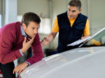 a man working for car insurance claim